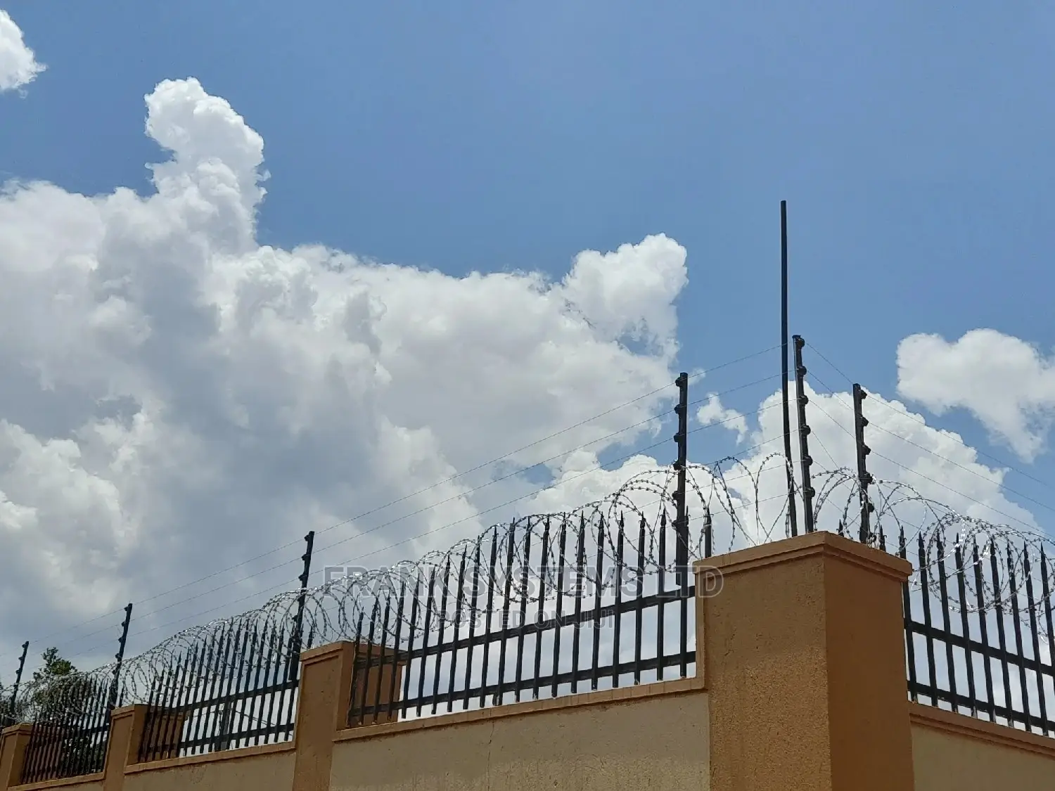 Electric Fence System With Razor Wire. Two In One
