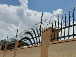 Electric Fence System With Razor Wire. Two In One