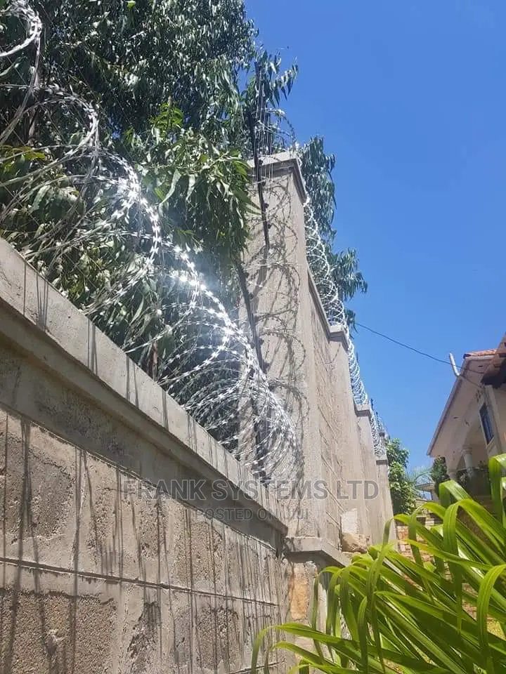 Electric Fencing System With Razor Wire.