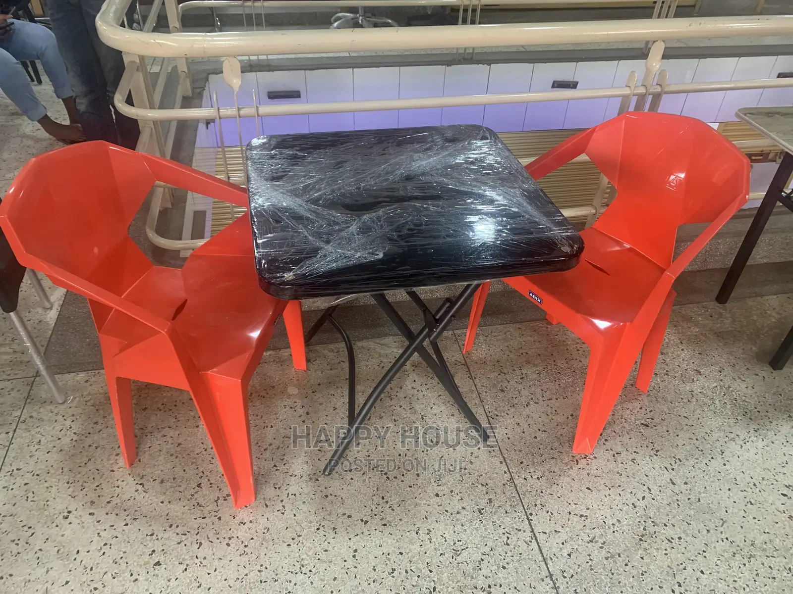 Set of Table and 2 Plastic Chairs.
