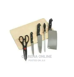 A Set of Kitchen Knives and Wooden Chopping Board
