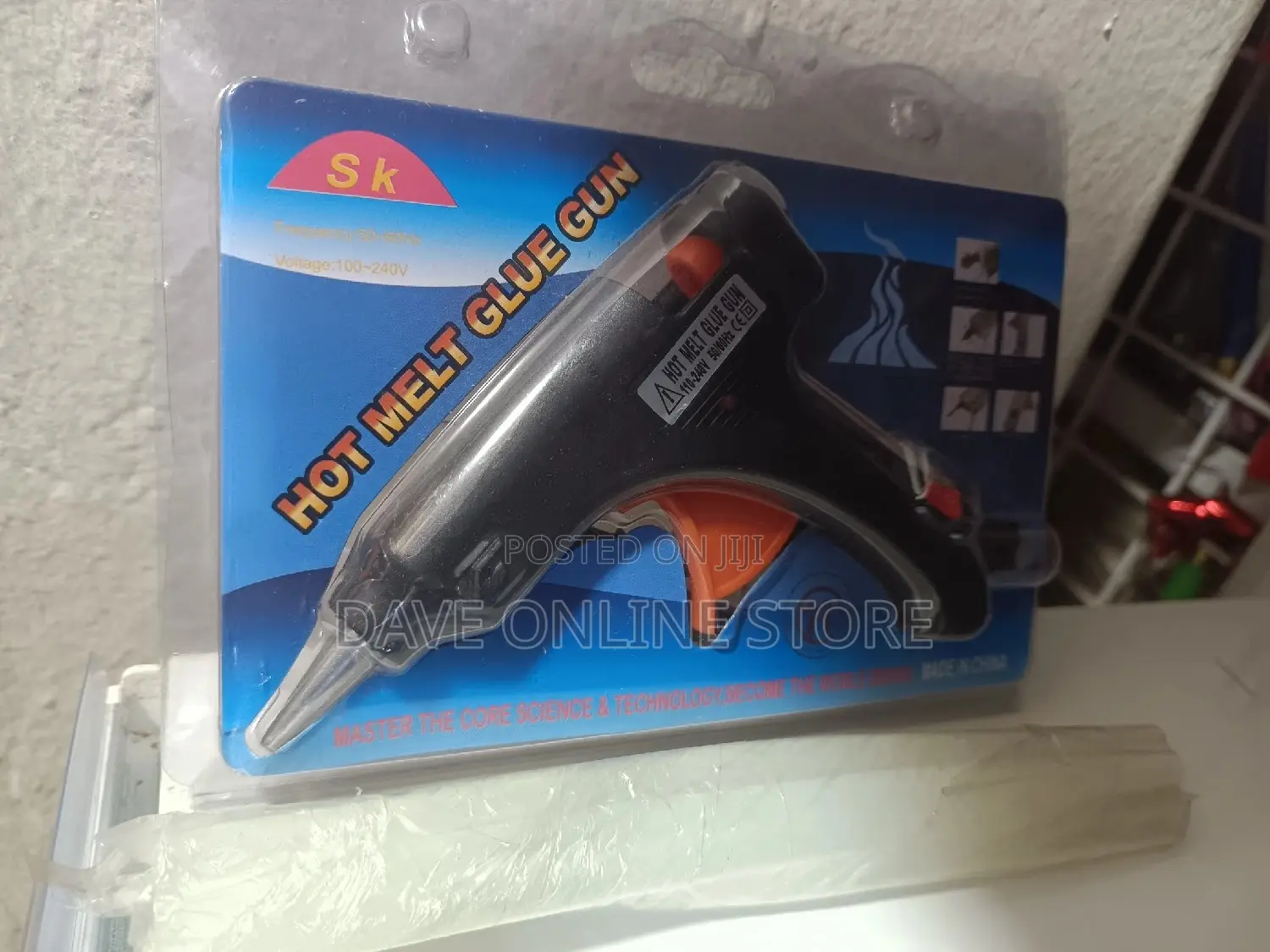 Small Size Glue Gun With Its Glue Sticks .