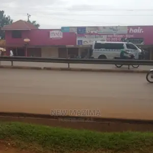 Busy Commercial Shops Measuring Direct on Tarmac of Ntebe Rd