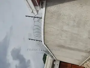 Electric Fence System With Roofing Razor Wire