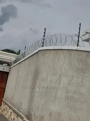 Electric Fence System With Roofing Razor Wire