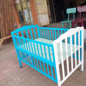Baby Bed From a Combination of Mahogany Wood and Plywood