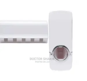 White Toothpaste Dispenser and Toothbrush Holder Set