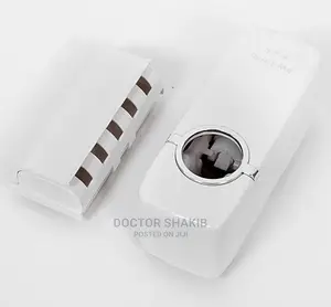 White Toothpaste Dispenser and Toothbrush Holder Set