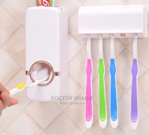 White Toothpaste Dispenser and Toothbrush Holder Set