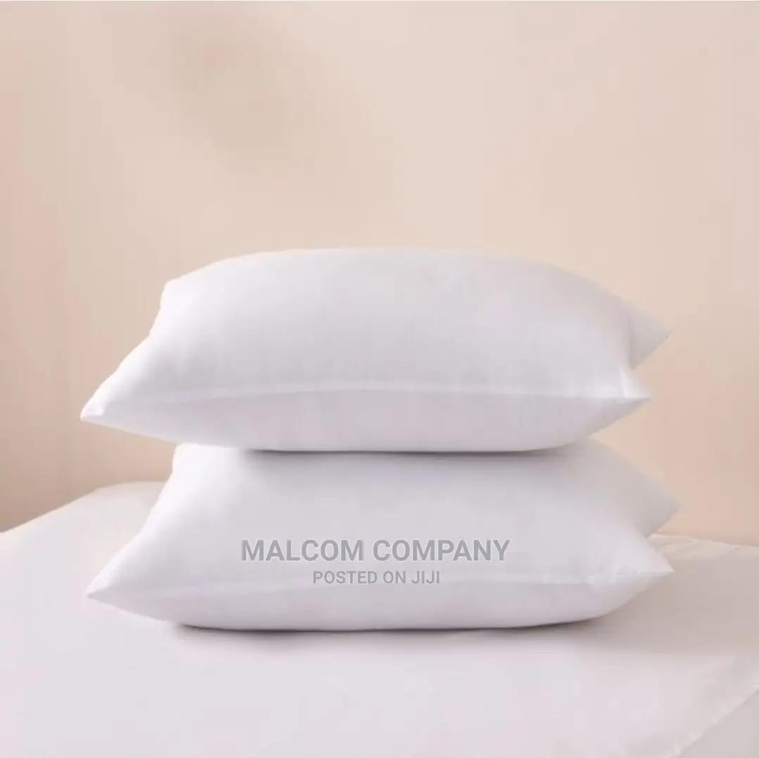 A Pair of Plain White Fibre Pillows