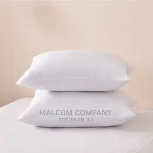 A Pair of Plain White Fibre Pillows