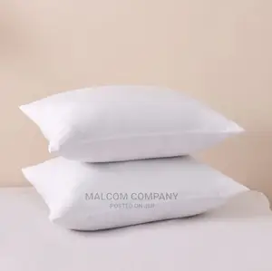 A Pair of Plain White Fibre Pillows