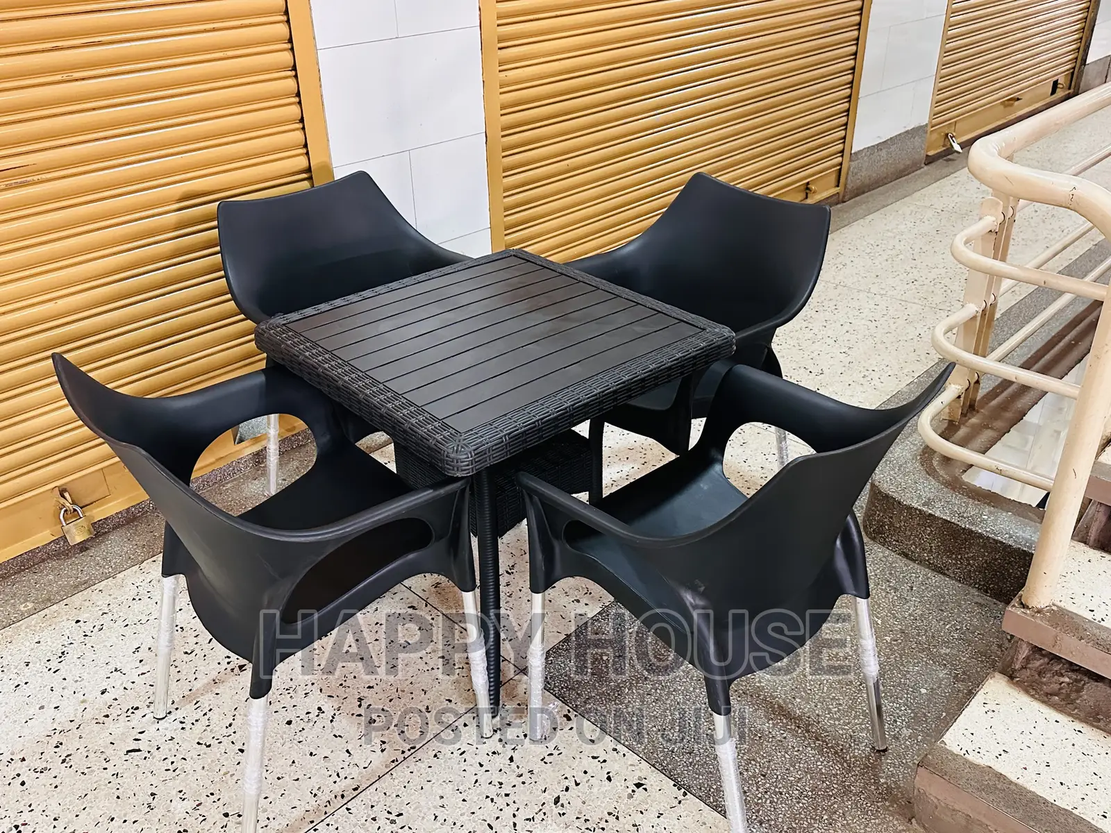 Set of Table and Four Plastic Chairs