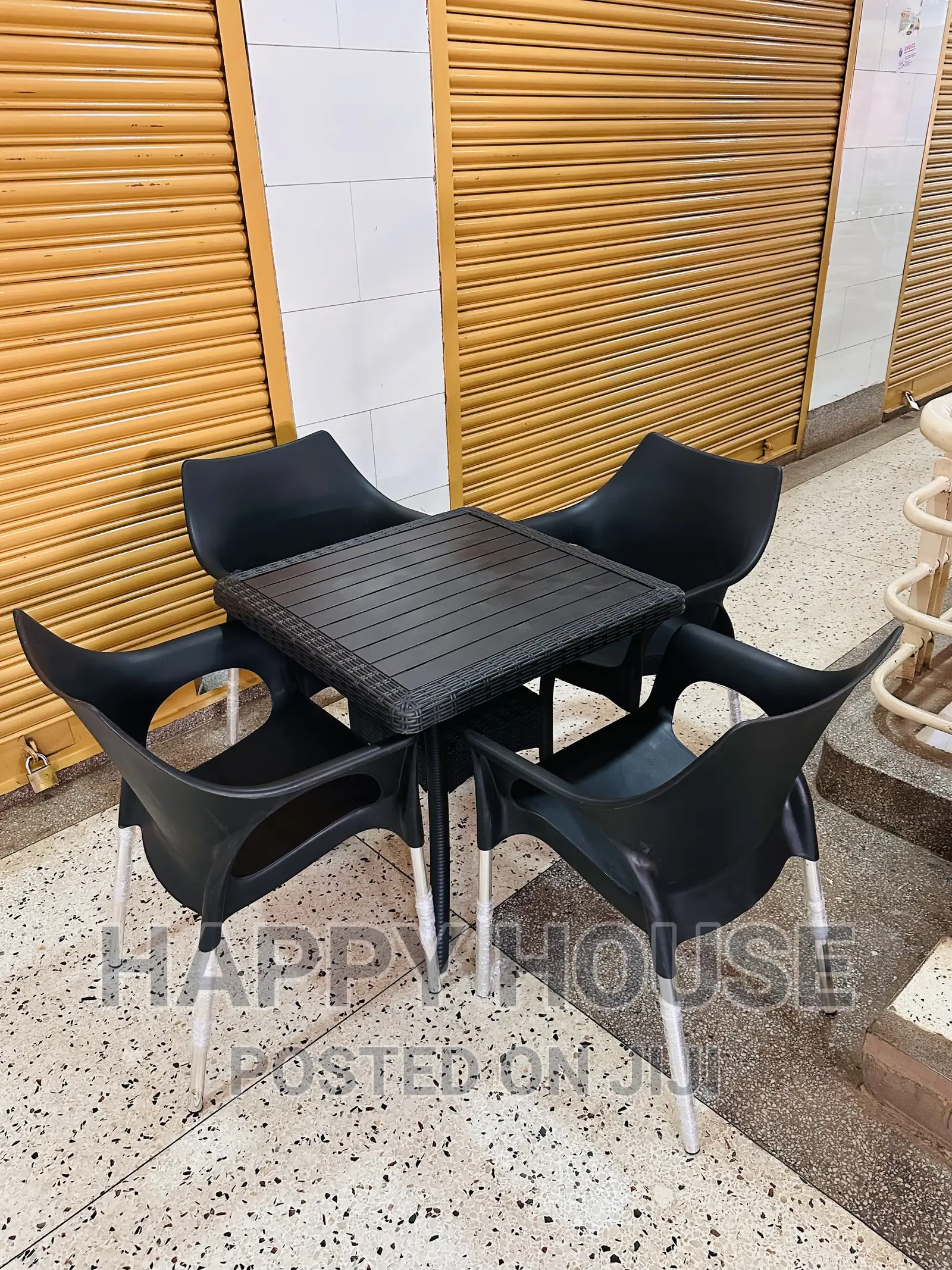 Set of Table and Four Plastic Chairs