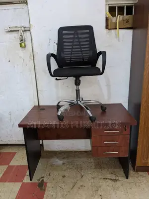 A Office Desk With Mesh Chair