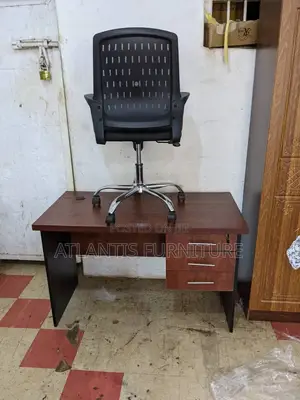 A Office Desk With Mesh Chair