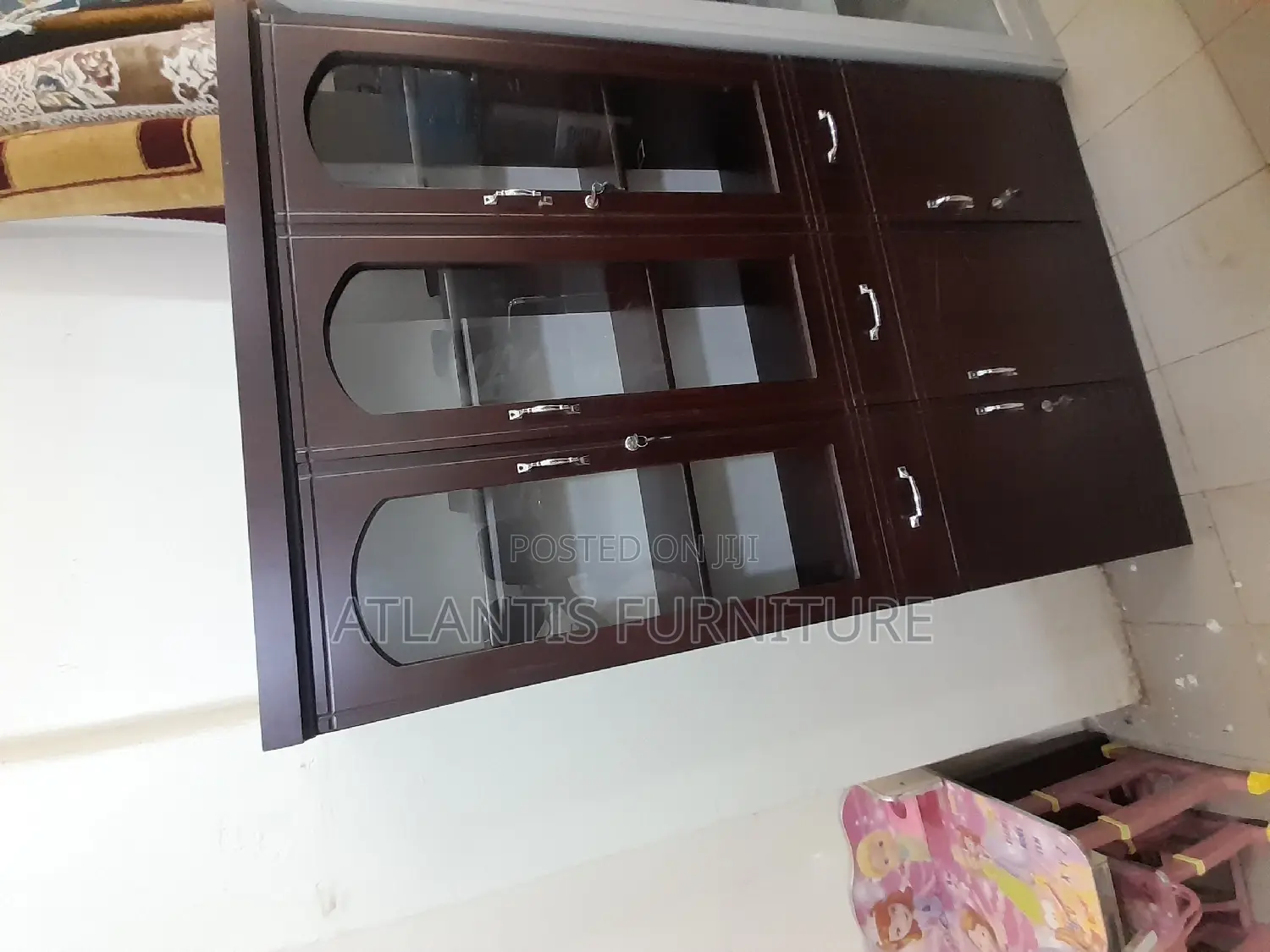 A Cupboard Three Door Cabinet.
