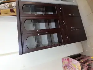 A Cupboard Three Door Cabinet.