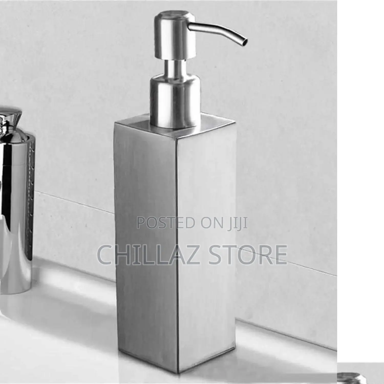 Stainless Steel Silver Soap Dispenser.