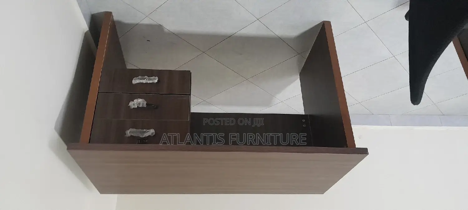 An Executive Office Table With Three Drawers
