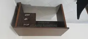 An Executive Office Table With Three Drawers