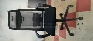 A Netted High Back Office Chair With Headrest .