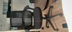 An Extraordinary Netted Office Chair With Arms