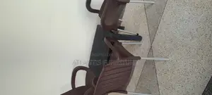 A Plastic Table (Very Nice)With Three Chairs.
