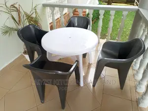 4pieces of Plastic Sofa Chairs With It's Round Table