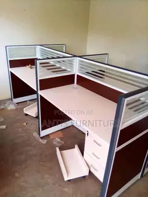 A Four Seater Workstation With Straight Tops and Drawers