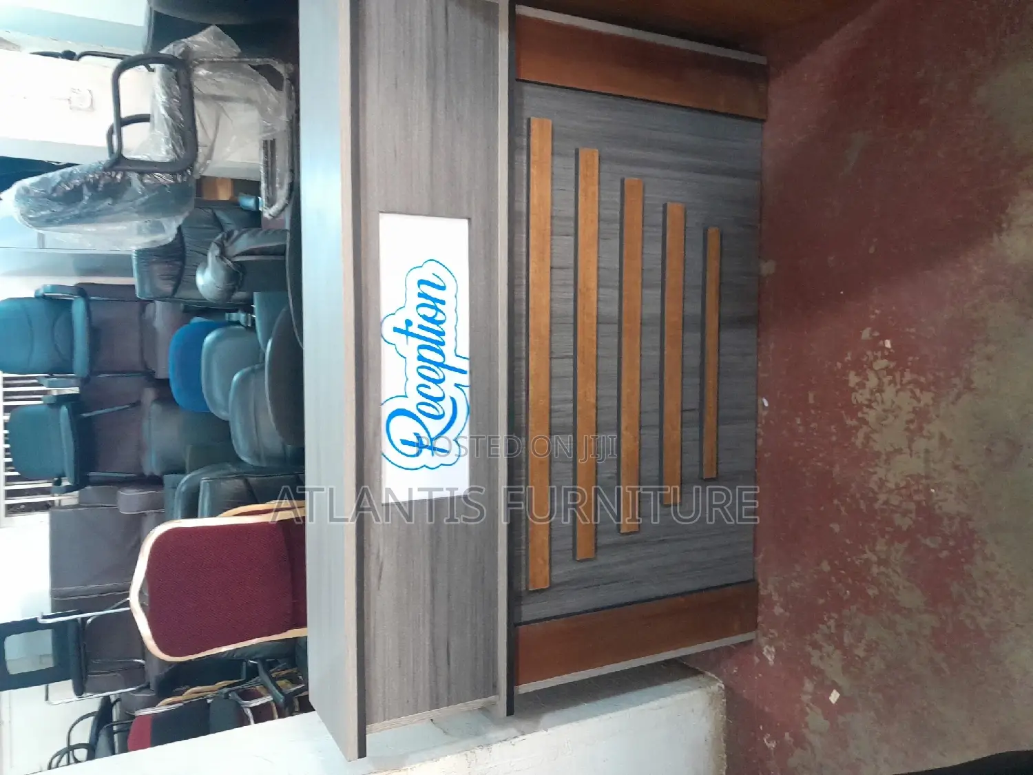 A Well Crafted Reception Desk With Stripes and Drawers