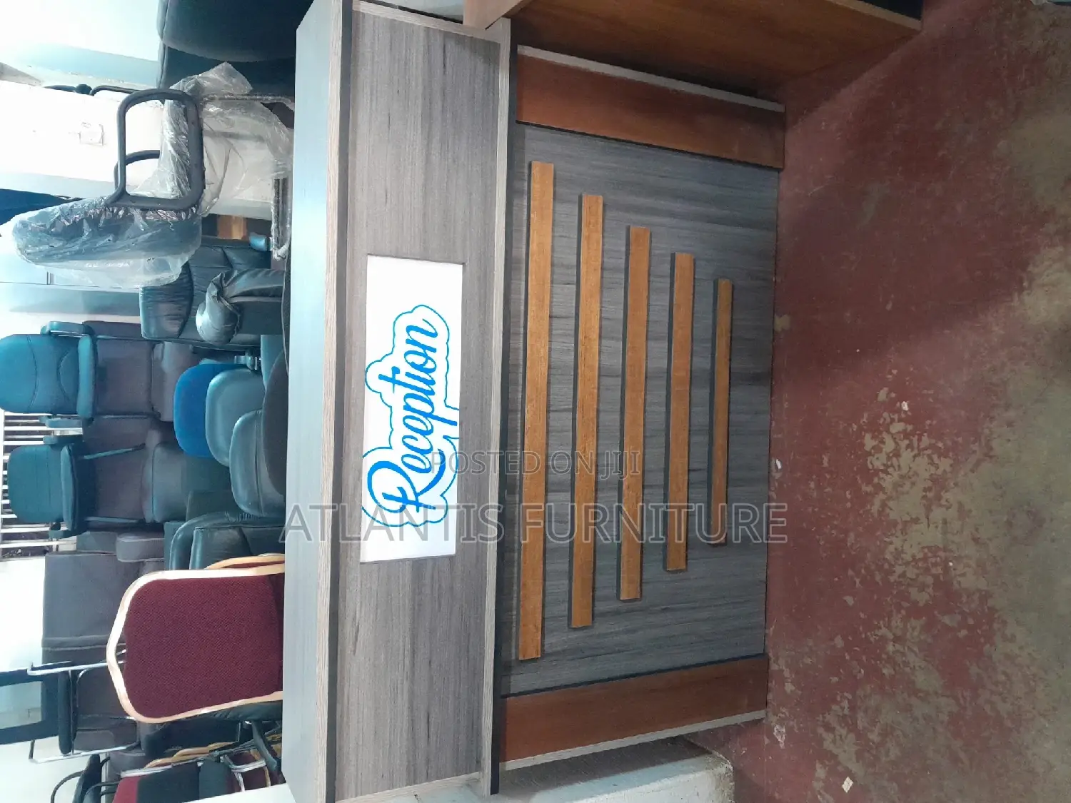 A Well Crafted Reception Desk With Stripes and Drawers