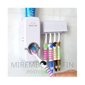 Toothpaste Dispenser With a Toothbrush Holder