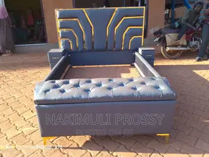 Classy Gray Leather Bed With Bedsides and Ottoman