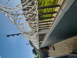 Electrified Fence System Backup With Razor Wire.