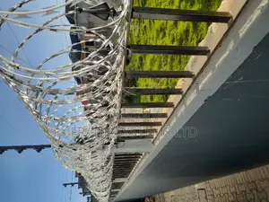 Electrified Fence System Backup With Razor Wire.