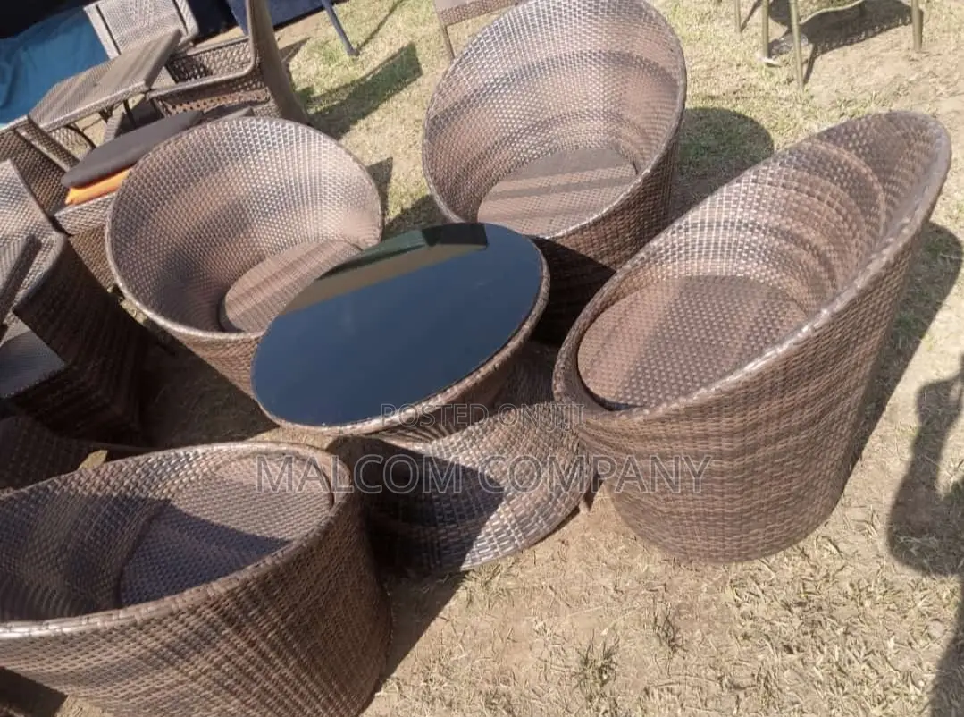 Crafted Four Chair and a Round Table With Metallic Frame.