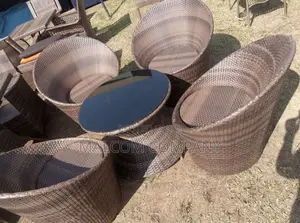 Crafted Four Chair and a Round Table With Metallic Frame.