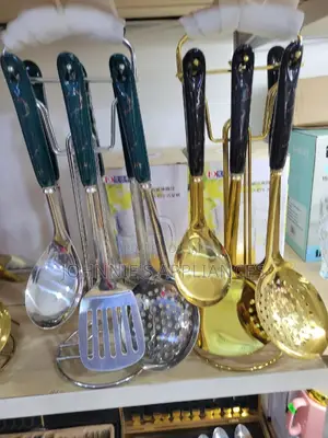 Gold And White Ceramic Serving Spoons On Are Set