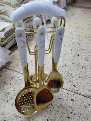 Gold And White Ceramic Serving Spoons On Are Set