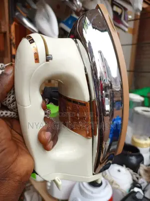 Heavy Duty Flat Iron. Deluxe Automatic Iron.