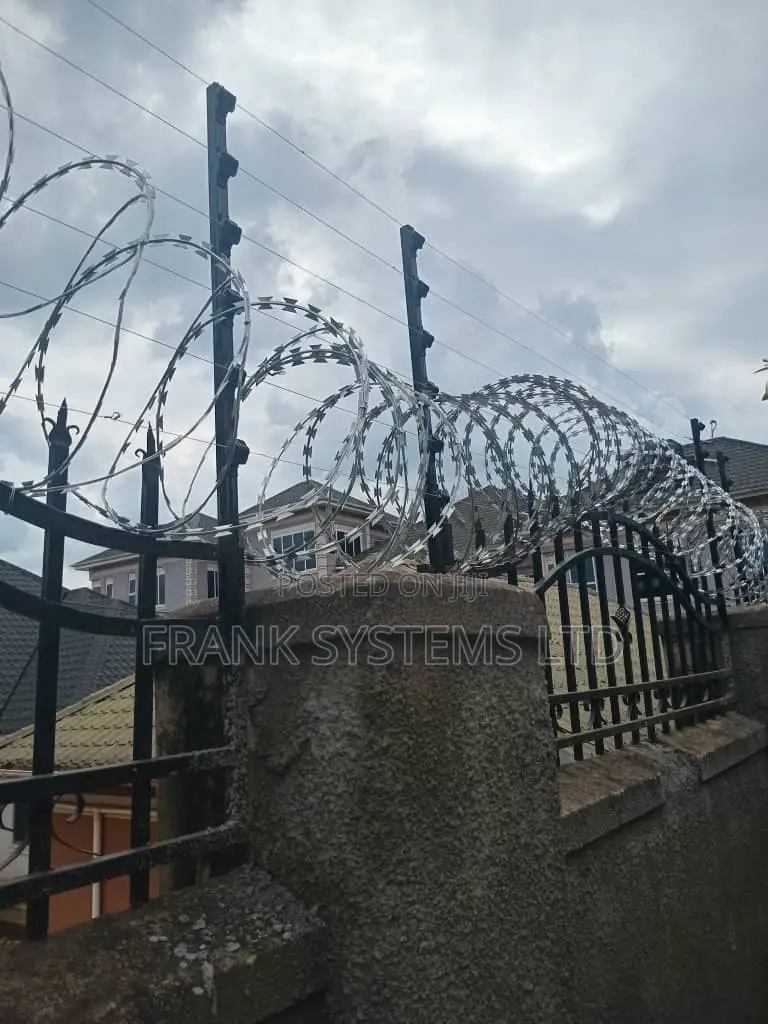 Electric Fence System With Razor Wire on Grills