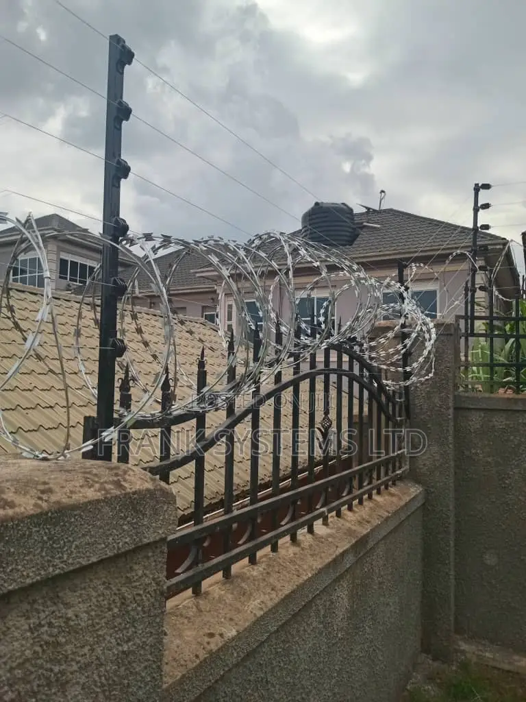 Electric Fence System With Razor Wire on Grills