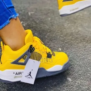 Yellowy Air Jordan 4 Retro Sneakers
