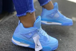 Blue Air Jordan 4 Sneakers.
