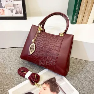 Gilded Women Leather Handbag. Maroon