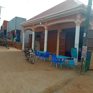 Three Commercial Double Shops With 8 Singles Onsale Nansana