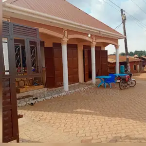 Three Commercial Double Shops With 8 Singles Onsale Nansana