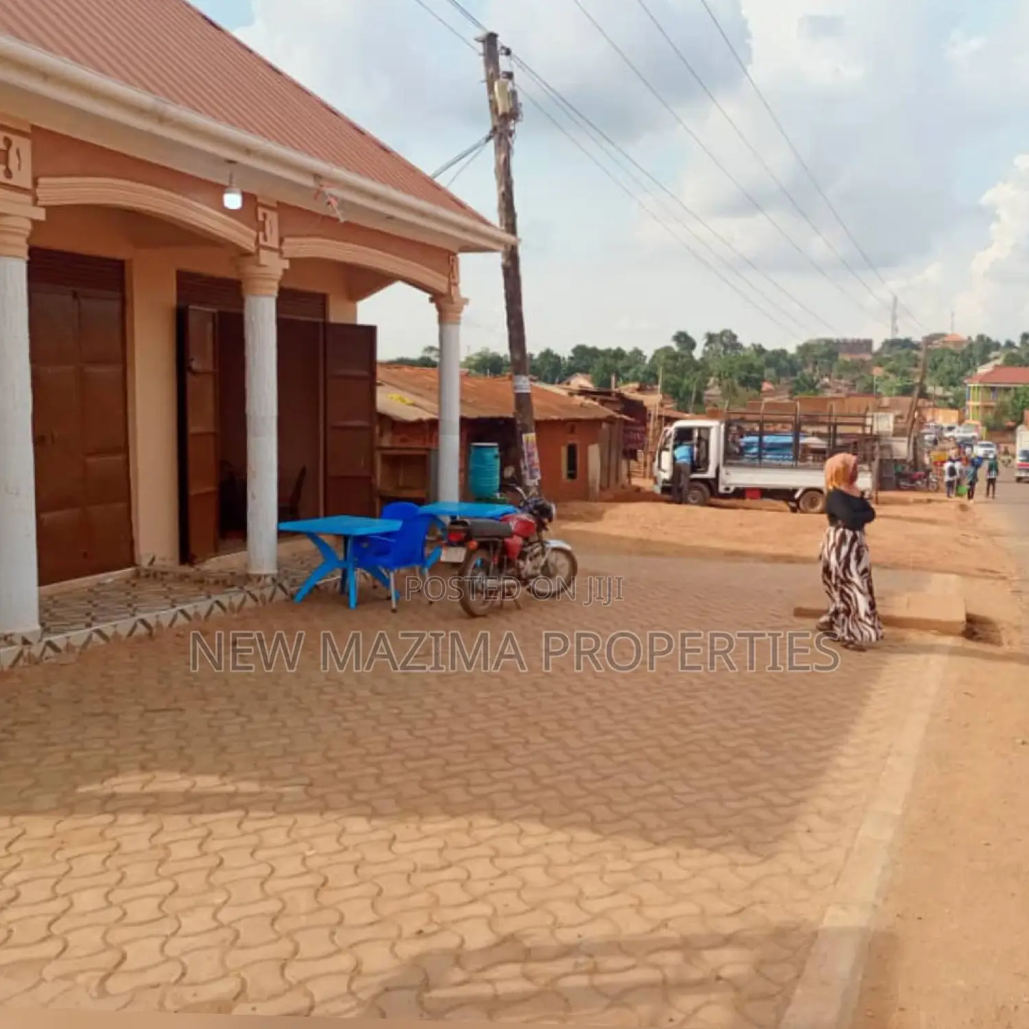 Three Commercial Double Shops With 8 Singles Onsale Nansana