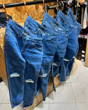 Knee Cut Blue Jeans. Ocean Colour